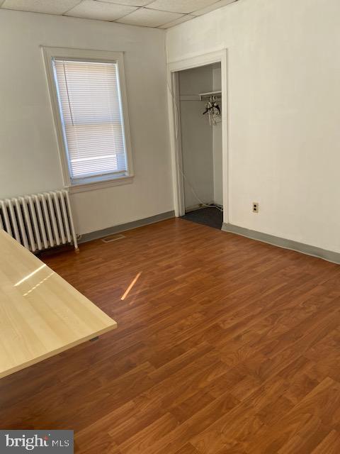 300 East Fort Avenue Baltimore, MD 21230 - Photo 7 of 14 an empty room with wooden floor and windows