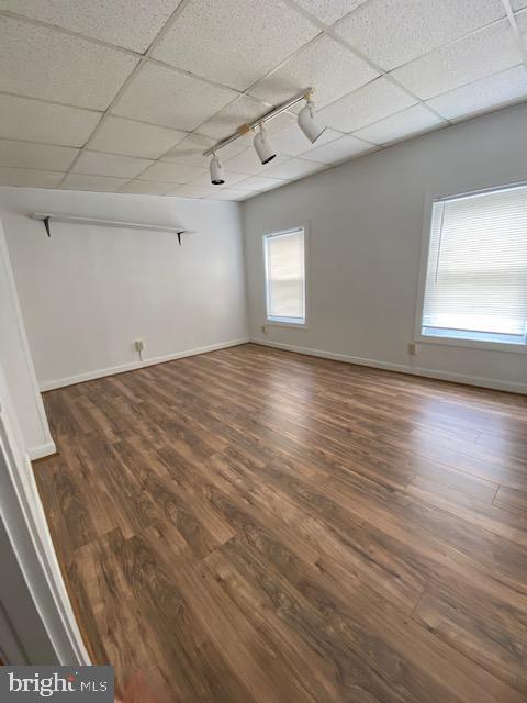 300 East Fort Avenue Baltimore, MD 21230 - Photo 10 of 14 an empty room with wooden floor and windows