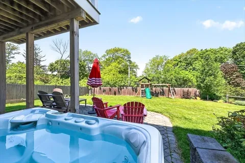 a view of swimming pool with a patio