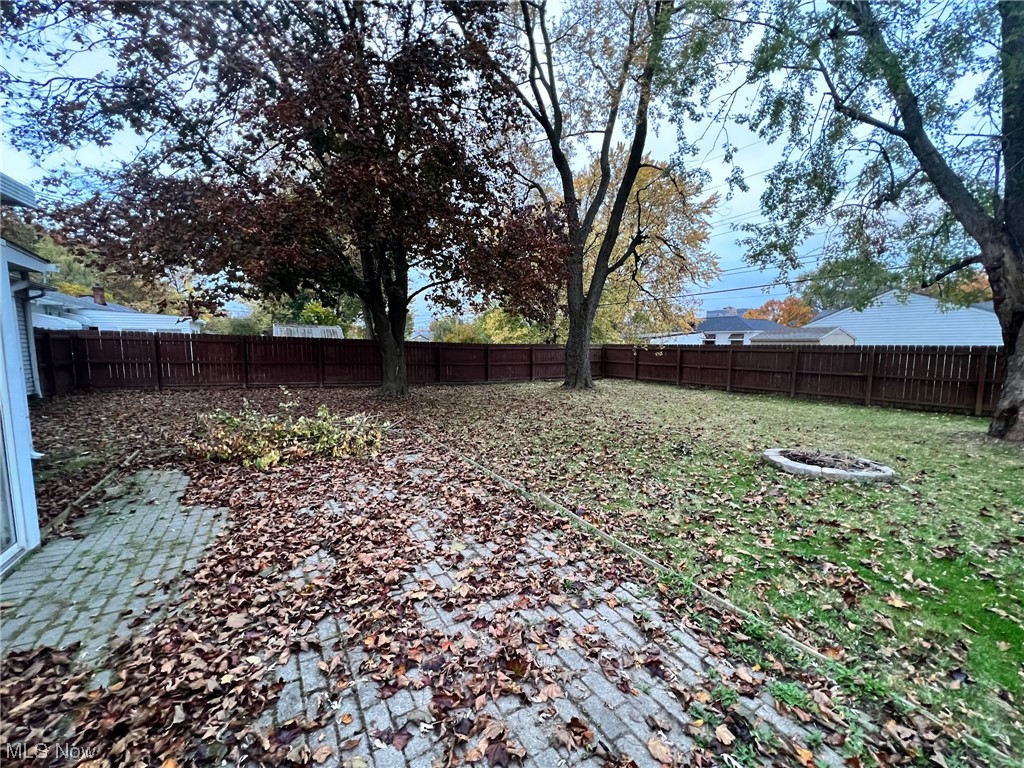 6830 Oakwood Road Parma Heights, OH 44130 - Photo 20 of 22 View of yard with an outdoor fire pit