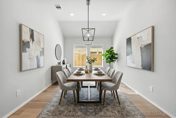 a kitchen with kitchen island a sink stainless steel appliances and cabinets