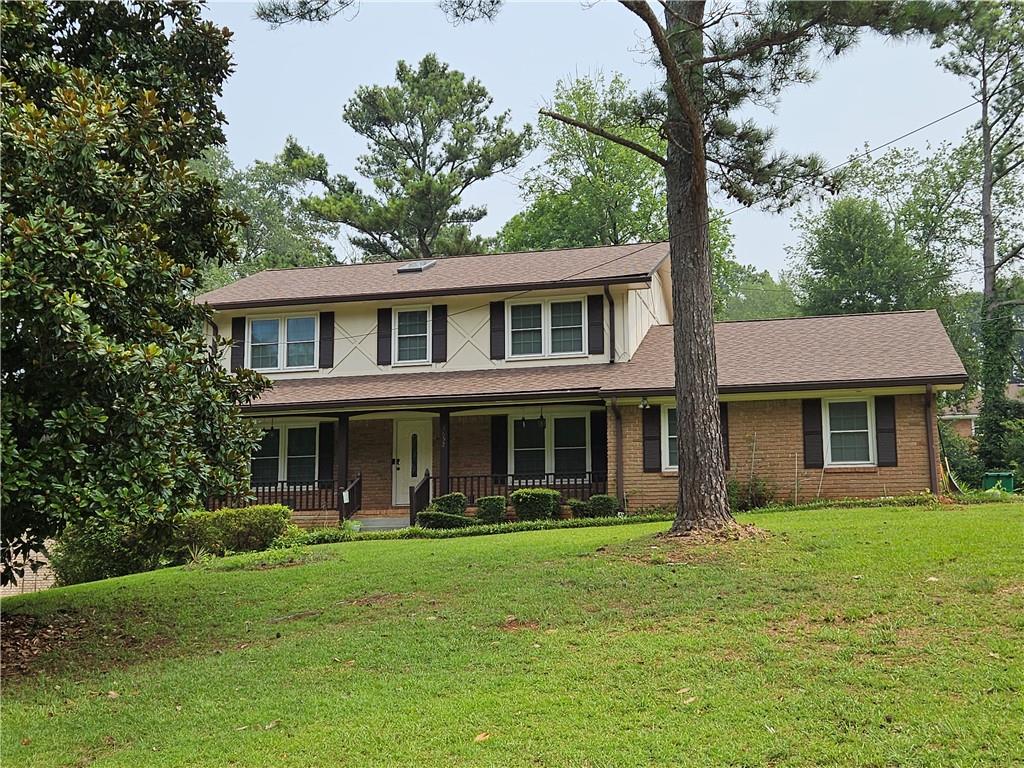 3652 Greentree Farms Drive Decatur, GA 30034 - Photo 1 of 1 a front view of a house with garden and trees