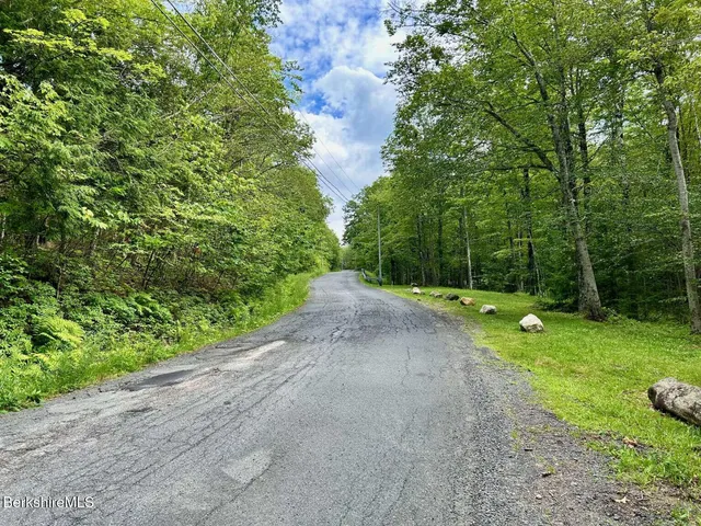 a view of outdoor space with deck and green space