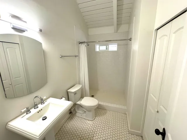 a bathroom with a sink and mirror