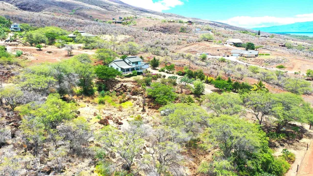 a view of a houses with a yard
