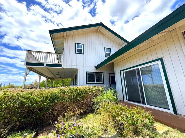 a house view with a garden space