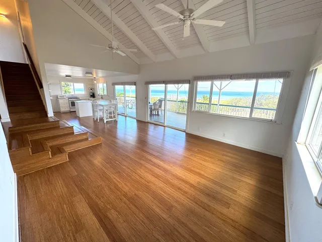 a view of a living room with wooden floor
