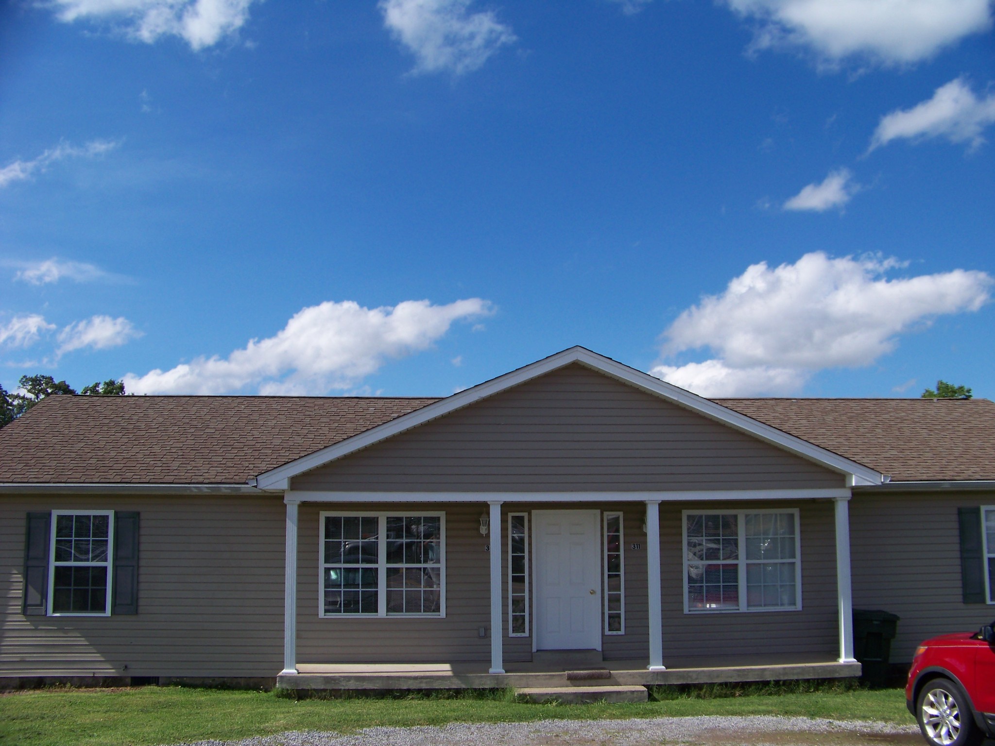 311 Reid Road Springfield, TN 37172 - Photo 1 of 16 a front view of a house with a garden