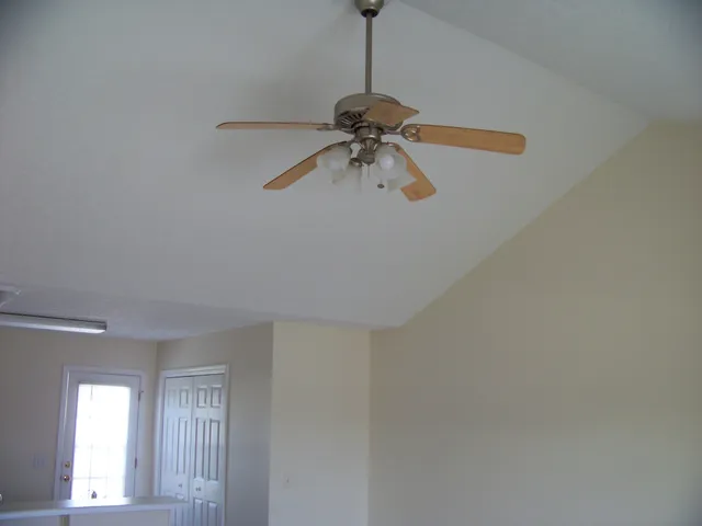 a view of a chandelier fan in a room