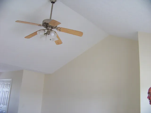 a view of a hallway with a chandelier