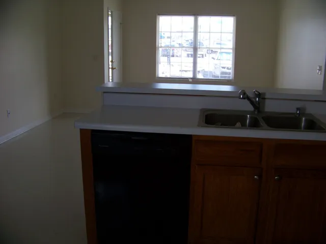 a view of a house with a sink and backyard