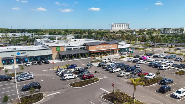 a city view with a couch and a garden