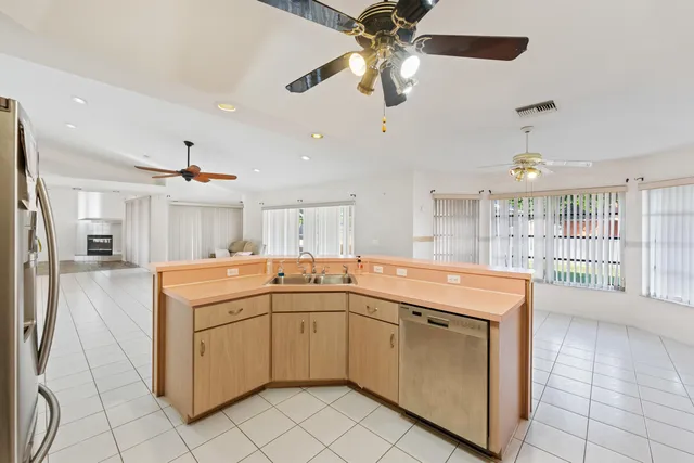 a view of a kitchen with a sink and dishwasher