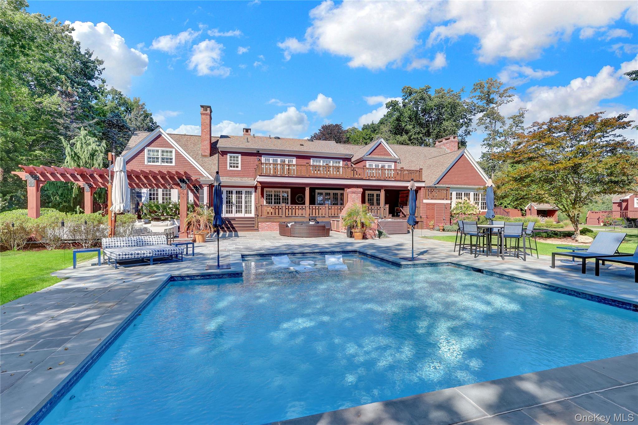 63 Dyke Road Setauket, NY 11733 - Photo 42 of 49 Swimming pool with a patio, a pergola, and a hot tub