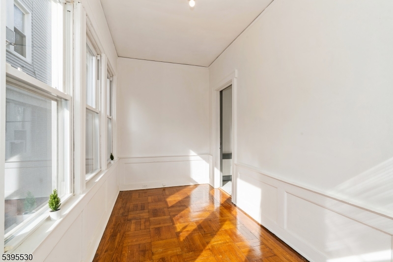 41 Poe Avenue Newark, NJ 07106 - Photo 12 of 44 a bathroom with a tub and shower