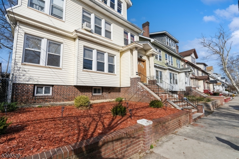 41 Poe Avenue Newark, NJ 07106 - Photo 34 of 44 a view of a big house with a yard
