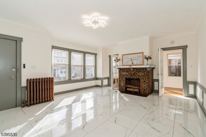 41 Poe Avenue Newark, NJ 07106 - Photo 5 of 44 a view of livingroom with furniture and fireplace