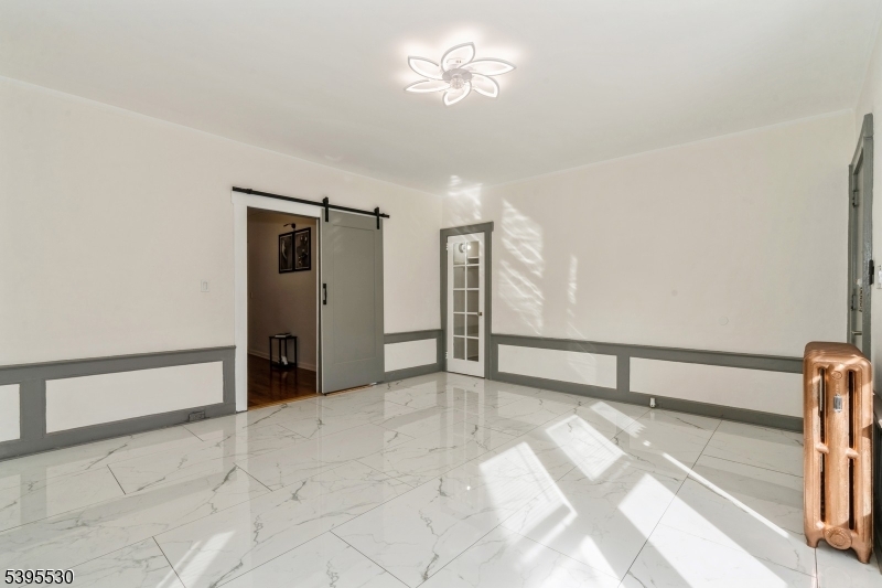 41 Poe Avenue Newark, NJ 07106 - Photo 8 of 44 a view of empty room with a ceiling fan