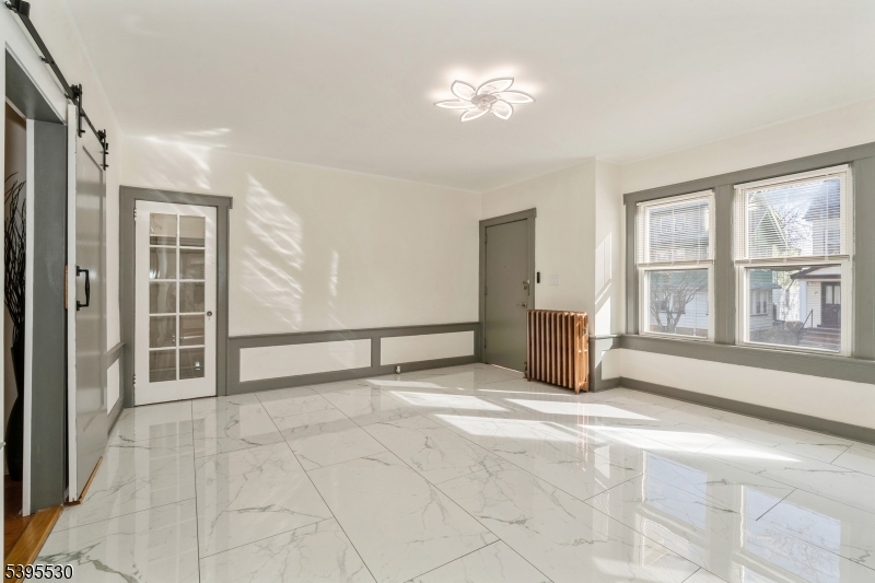 41 Poe Avenue Newark, NJ 07106 - Photo 9 of 44 a view of an empty room with a window