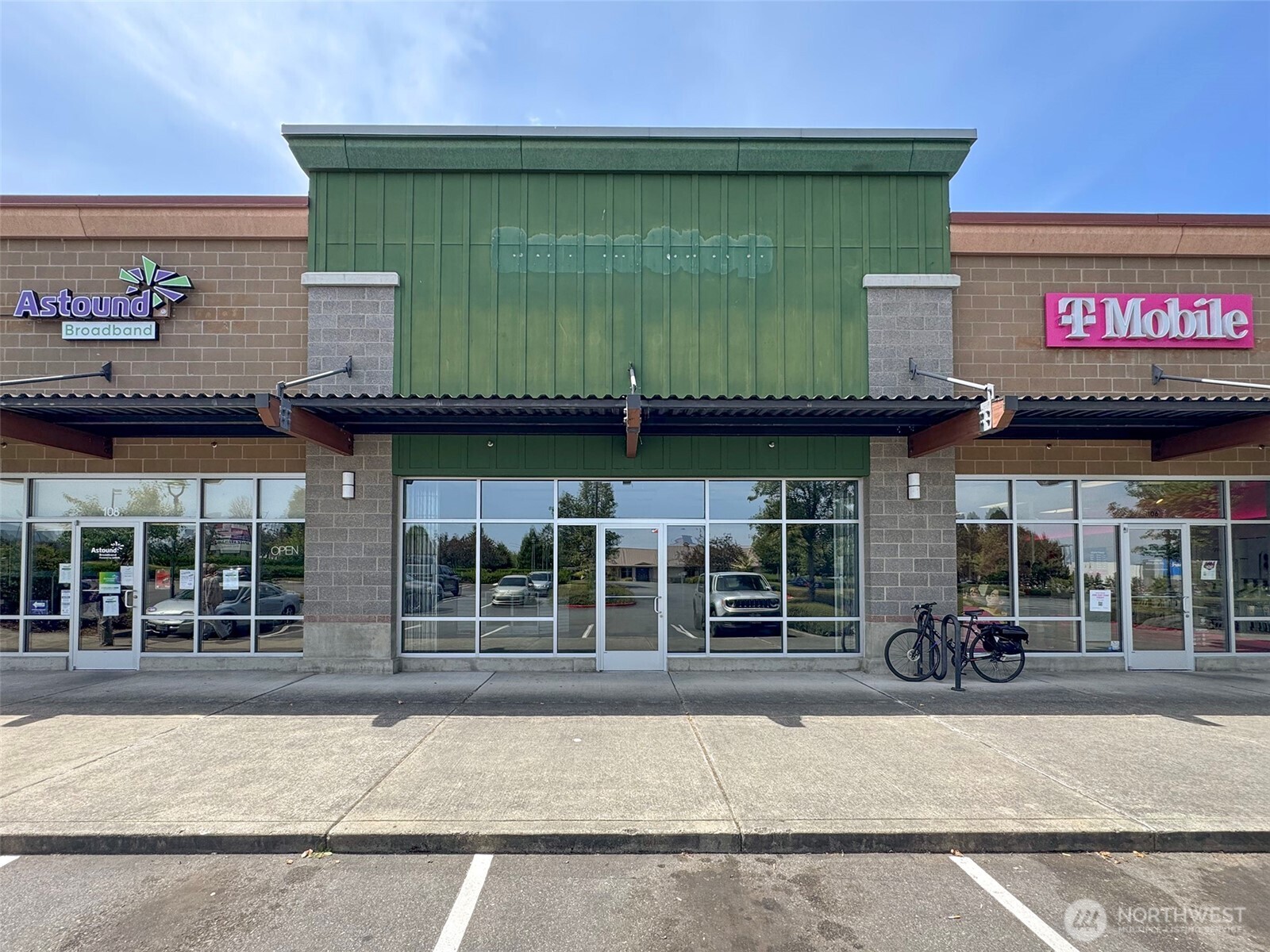 a view of a cafe with sitting area