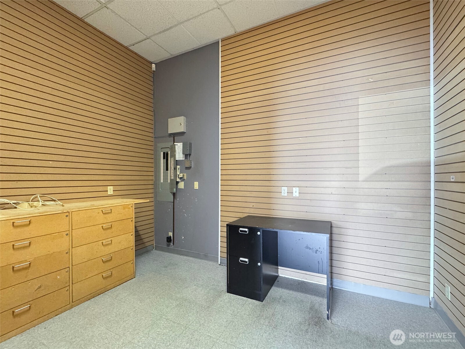 1400 West Washington Street, Unit 107 Sequim, WA 98382 - Photo 12 of 26 a view of an empty room with cabinet and a window