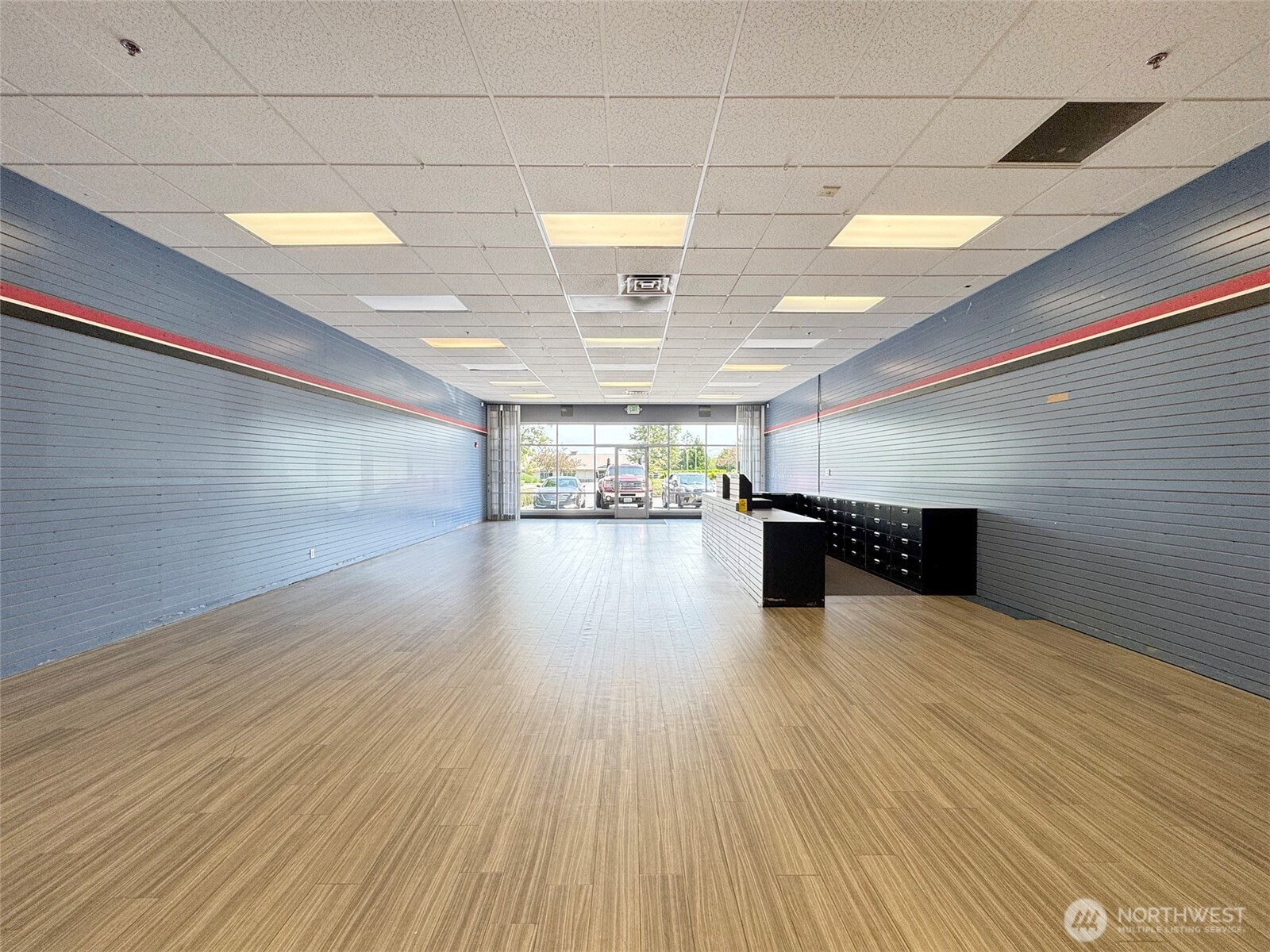 1400 West Washington Street, Unit 107 Sequim, WA 98382 - Photo 15 of 26 a view of a room with wooden floor
