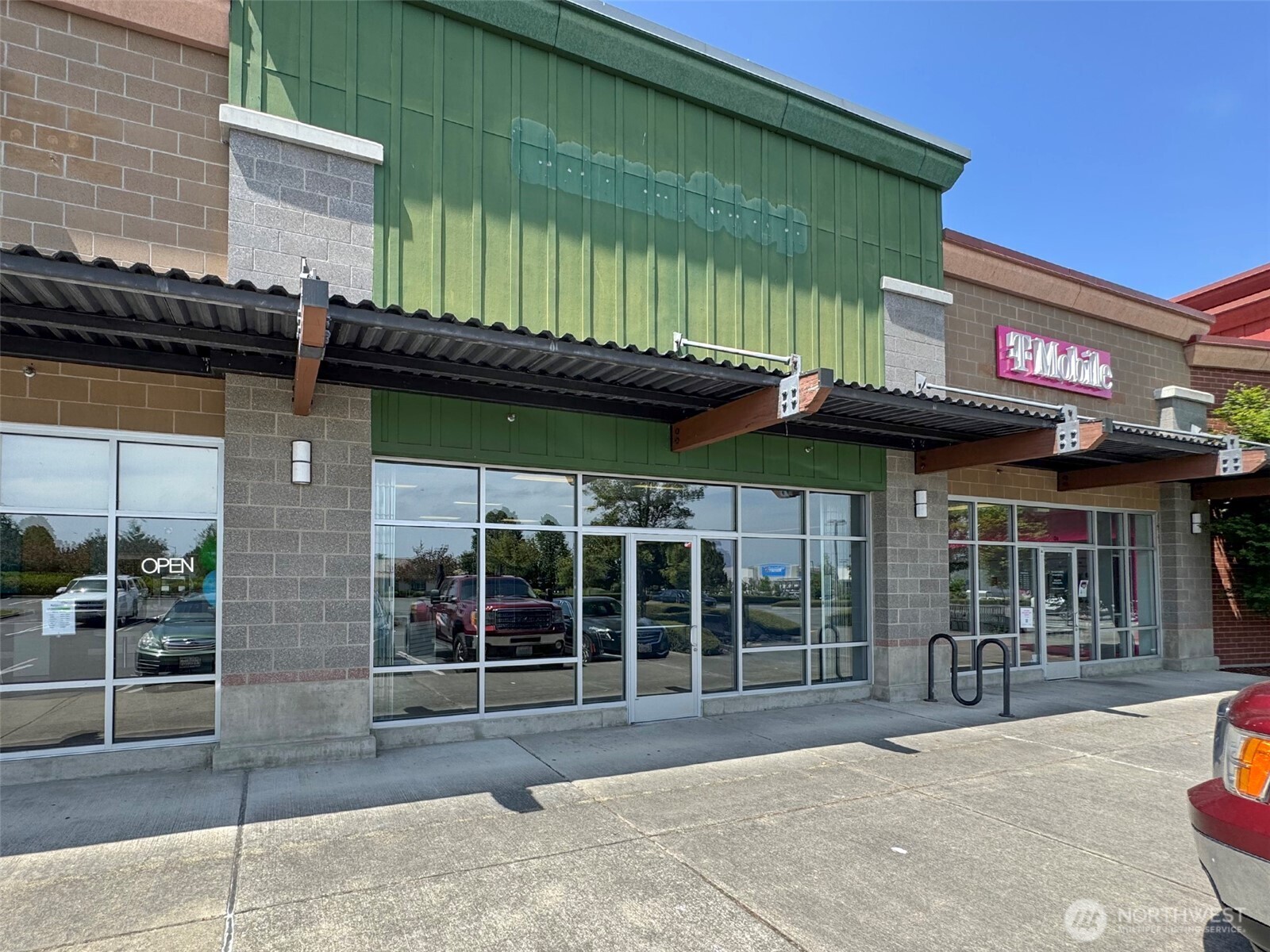 1400 West Washington Street, Unit 107 Sequim, WA 98382 - Photo 20 of 26 a view of a brick building with a large window