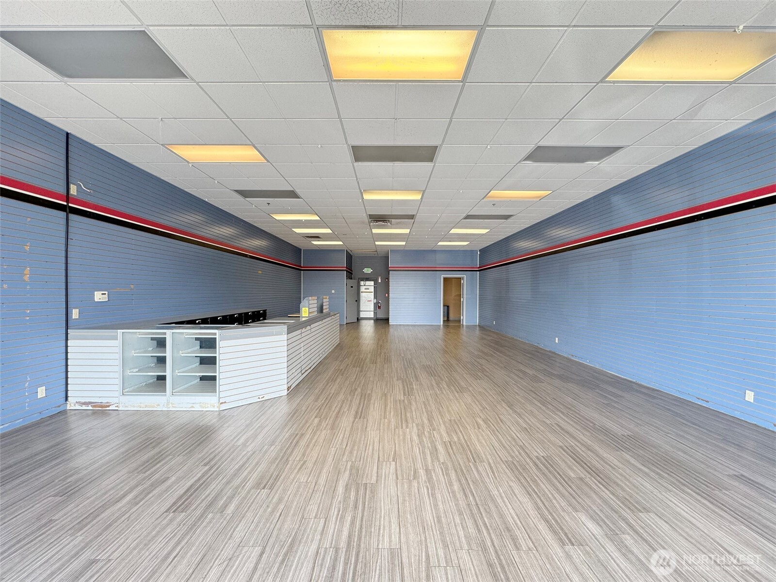 1400 West Washington Street, Unit 107 Sequim, WA 98382 - Photo 2 of 26 a view of a room with wooden floor
