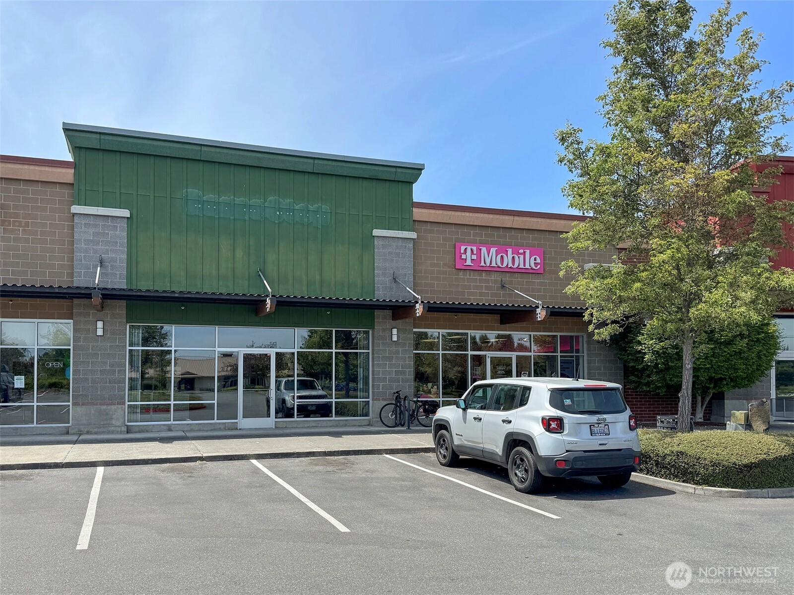 1400 West Washington Street, Unit 107 Sequim, WA 98382 - Photo 21 of 26 a car parked in front of a building