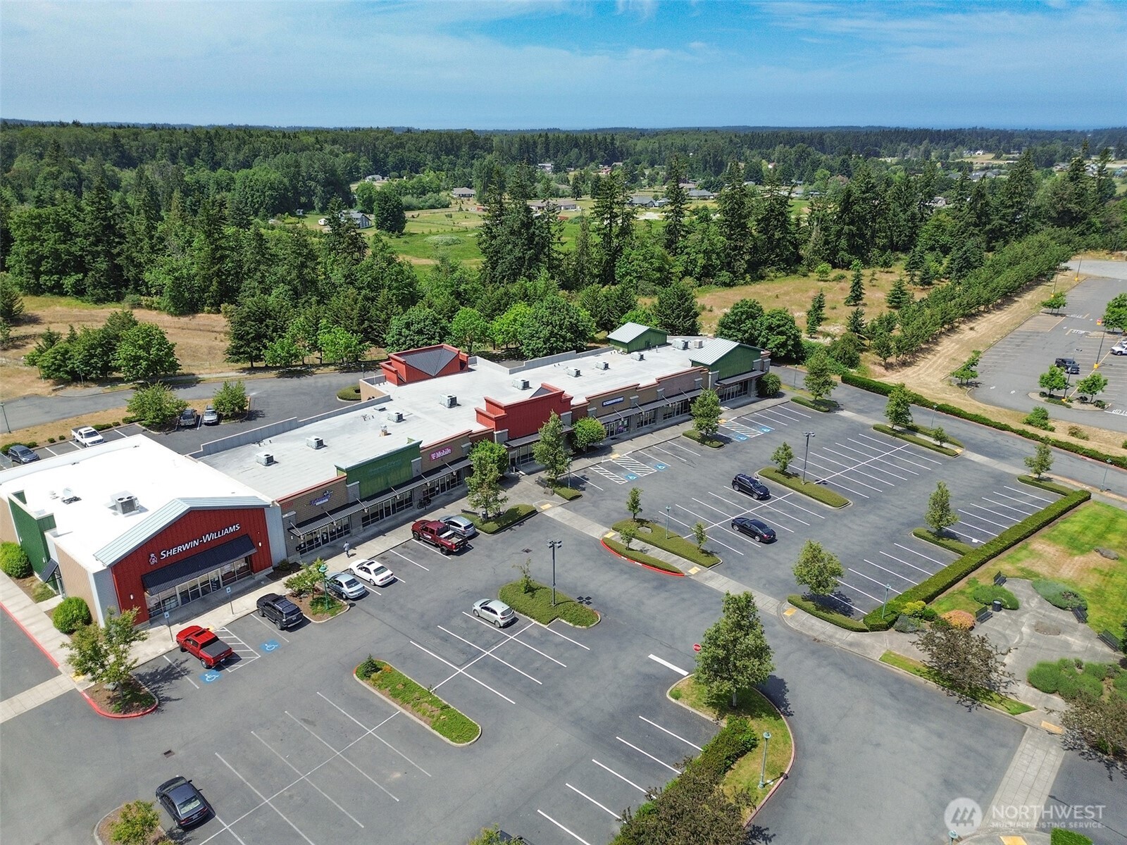 1400 West Washington Street, Unit 107 Sequim, WA 98382 - Photo 24 of 26 an aerial view of residential houses with outdoor space