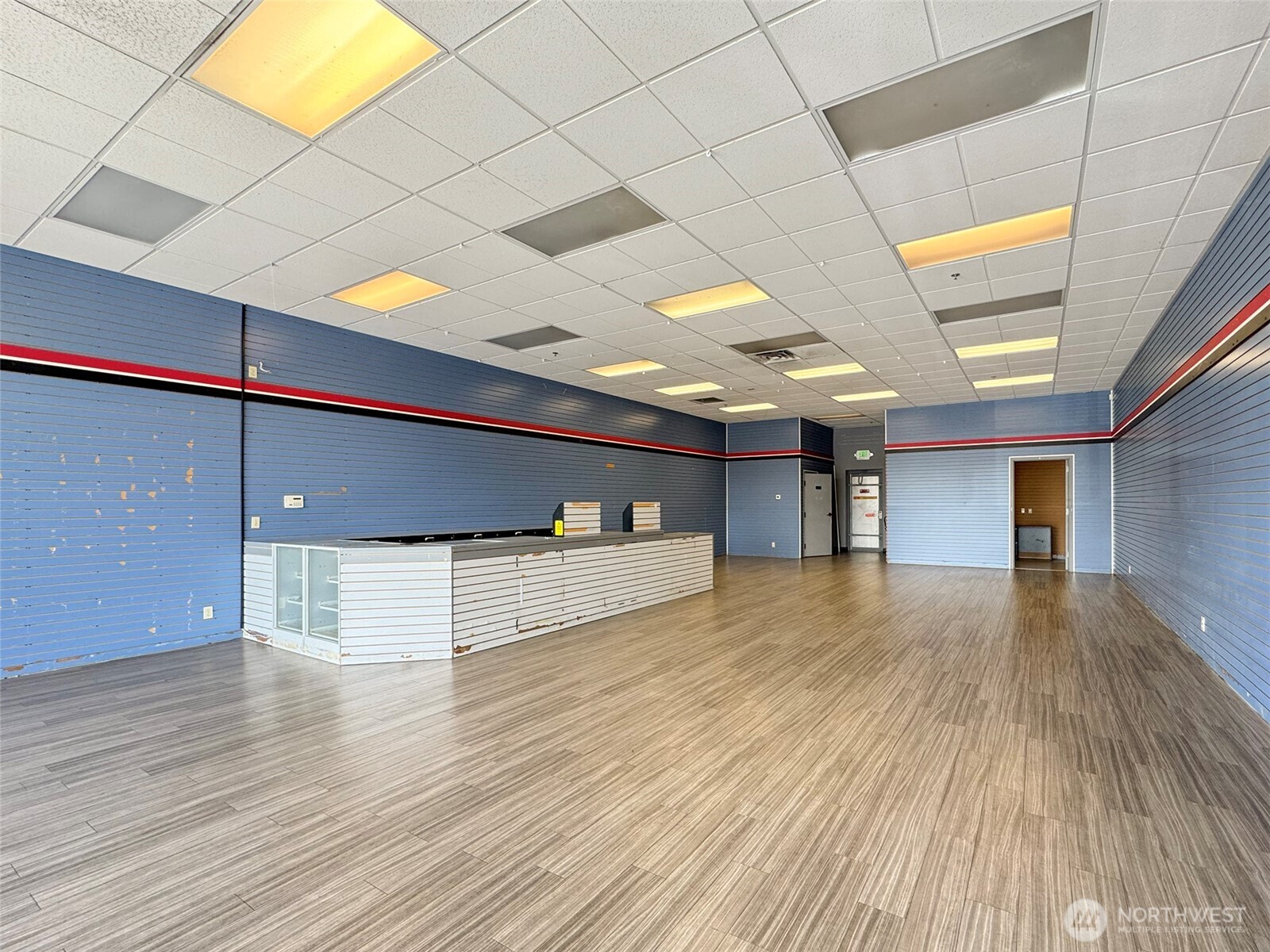 1400 West Washington Street, Unit 107 Sequim, WA 98382 - Photo 3 of 26 a view of a livingroom with an empty space and a window
