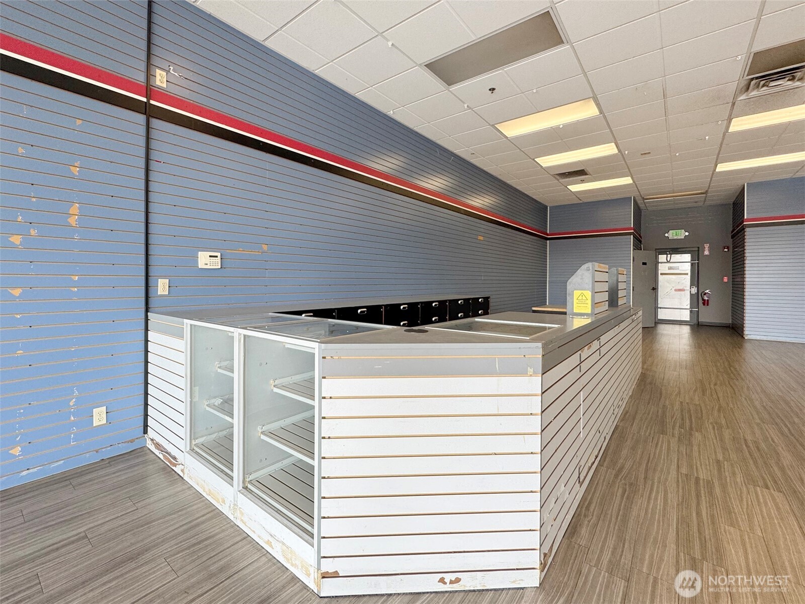 1400 West Washington Street, Unit 107 Sequim, WA 98382 - Photo 5 of 26 a view of entryway and hall with wooden floor