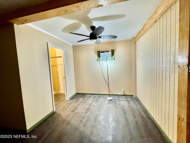 a view of an empty room with a window