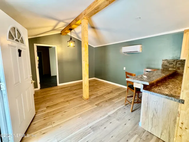 a bedroom with a bed and a table