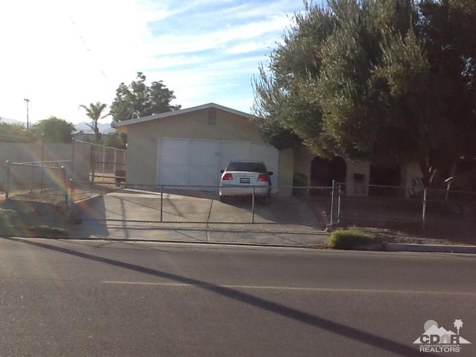 46751 Arabia Street Indio, CA 92201 - Photo 11 of 42 a view of a car parked in the road