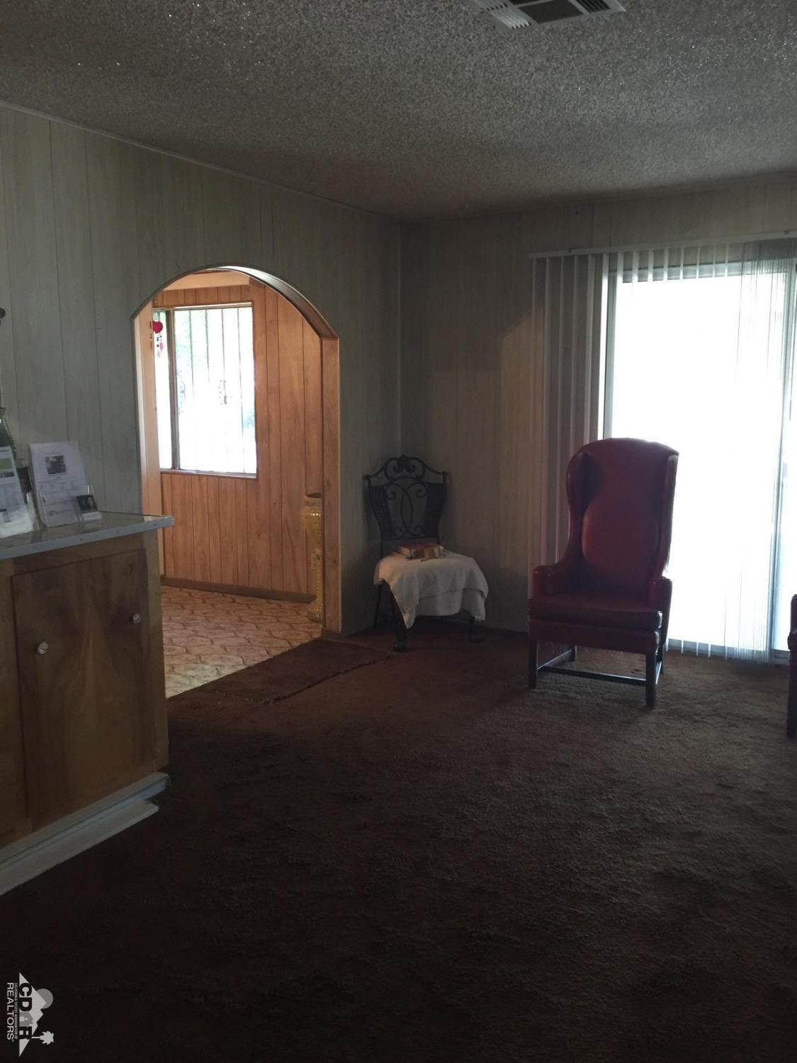 46751 Arabia Street Indio, CA 92201 - Photo 15 of 42 a living room with furniture and a window