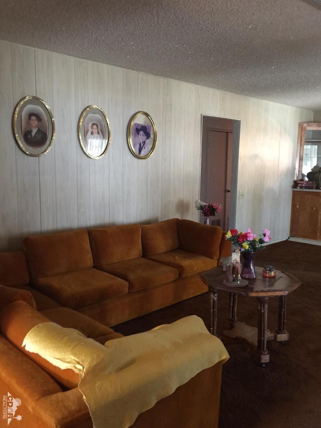 46751 Arabia Street Indio, CA 92201 - Photo 16 of 42 a living room with furniture and a wooden floor