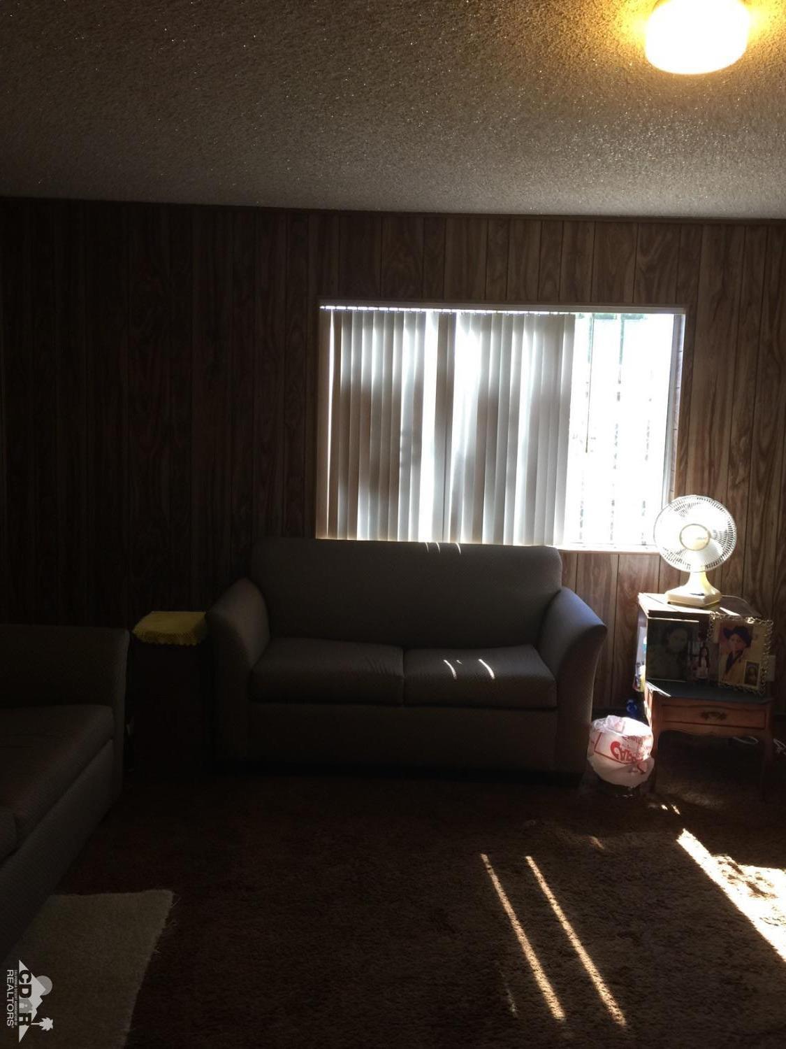 46751 Arabia Street Indio, CA 92201 - Photo 19 of 42 a living room with furniture and a large window