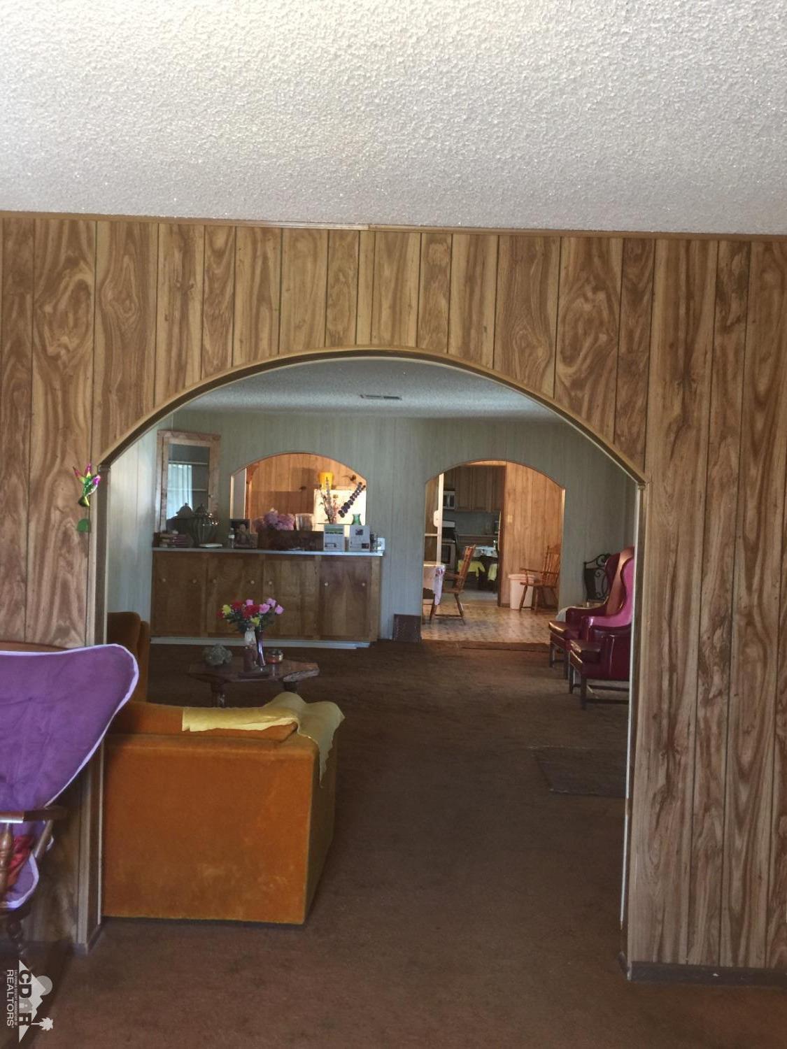 46751 Arabia Street Indio, CA 92201 - Photo 22 of 42 a living room with furniture and a fireplace
