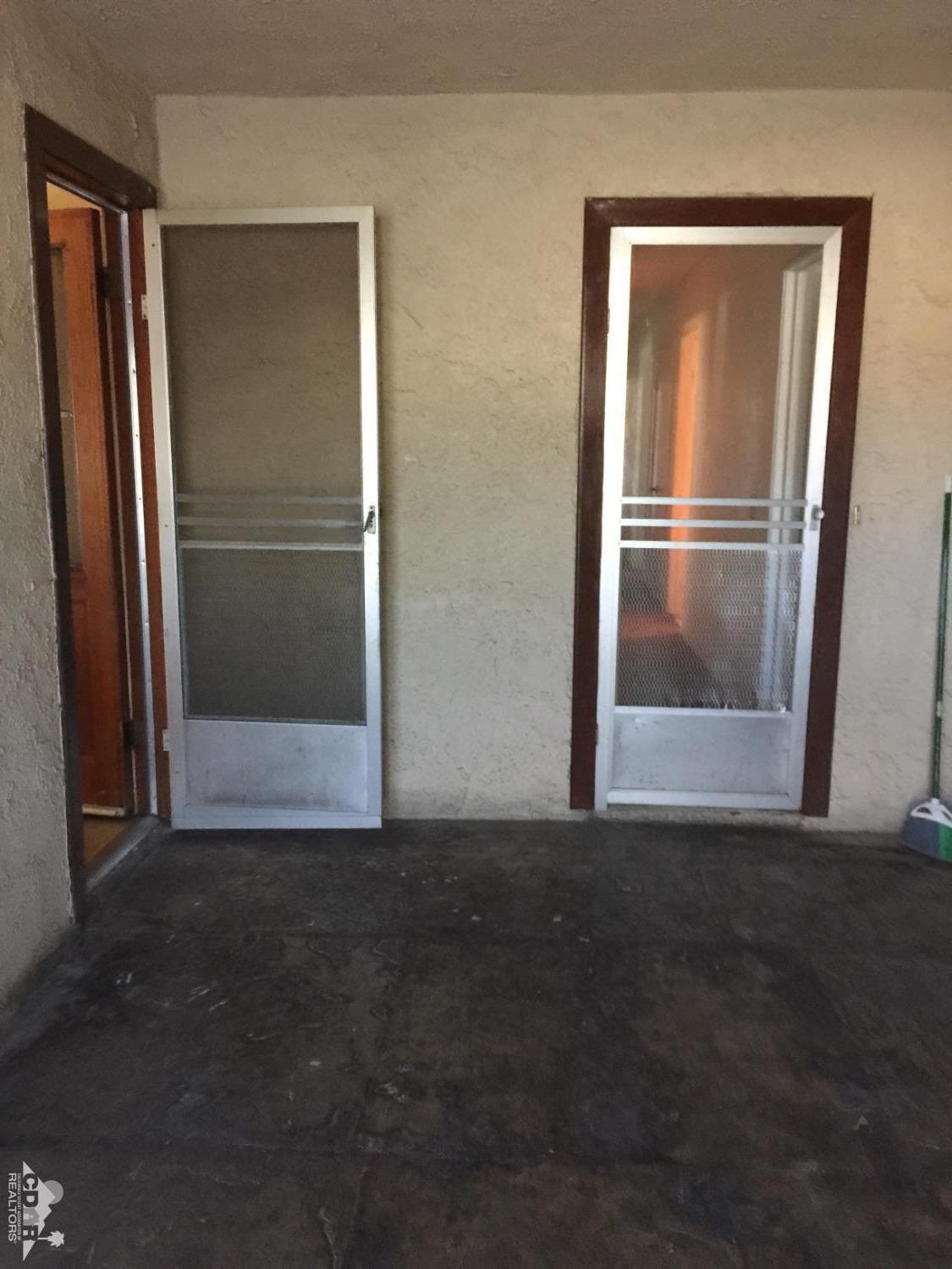 46751 Arabia Street Indio, CA 92201 - Photo 30 of 42 a view of empty room with front door