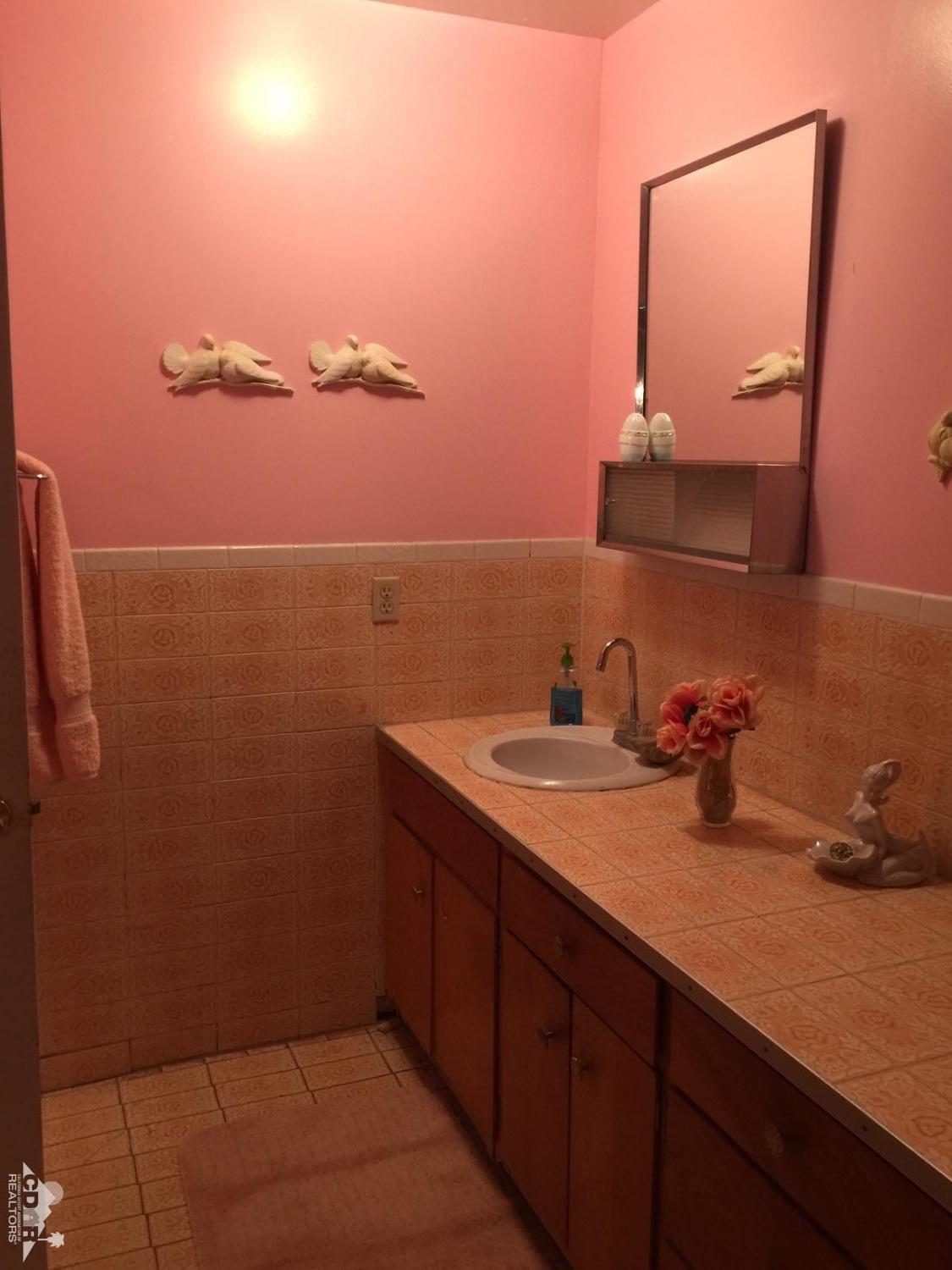 46751 Arabia Street Indio, CA 92201 - Photo 32 of 42 a bathroom with a sink and a mirror