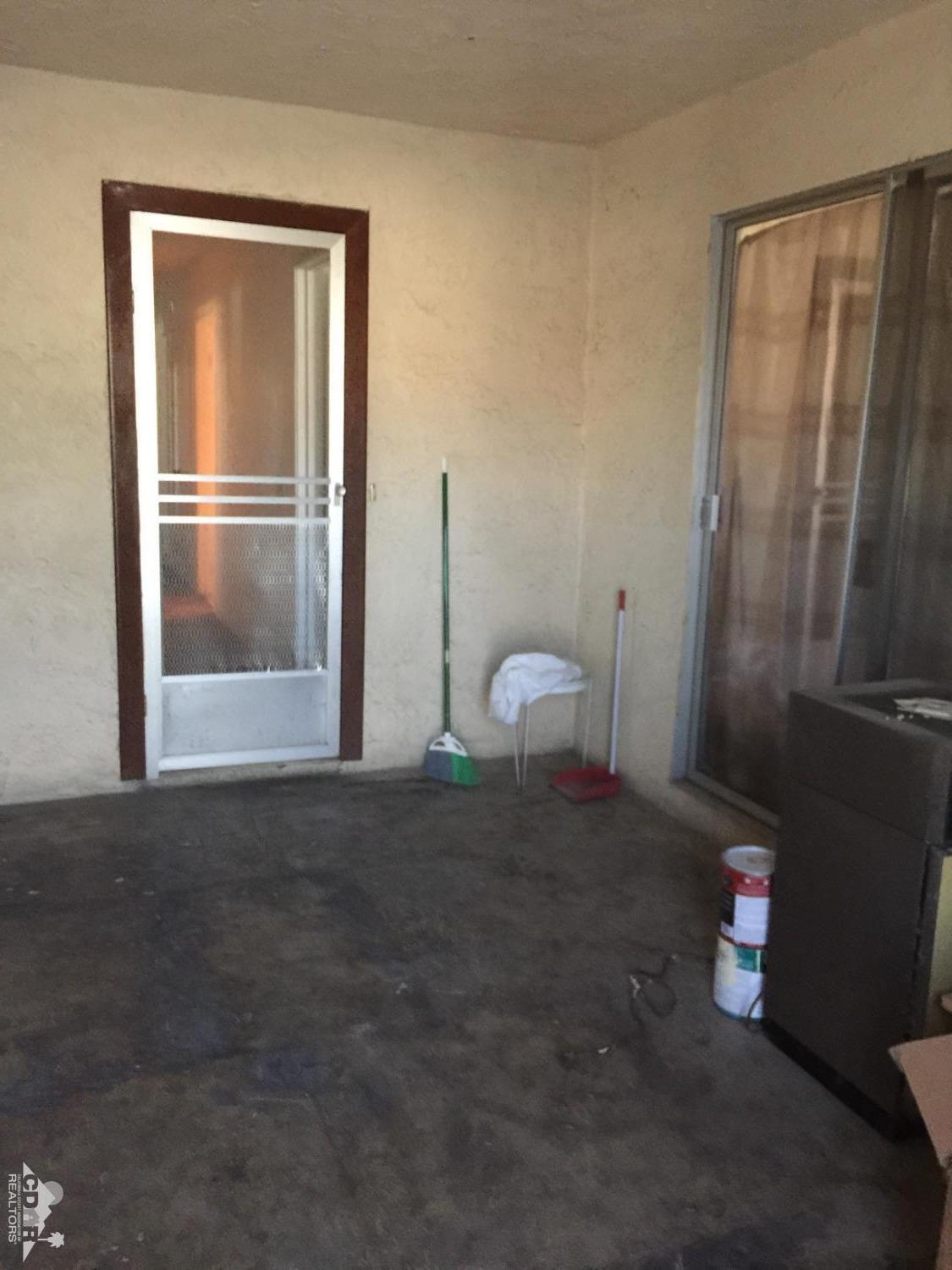 46751 Arabia Street Indio, CA 92201 - Photo 39 of 42 a view of empty room with wooden floor and fan