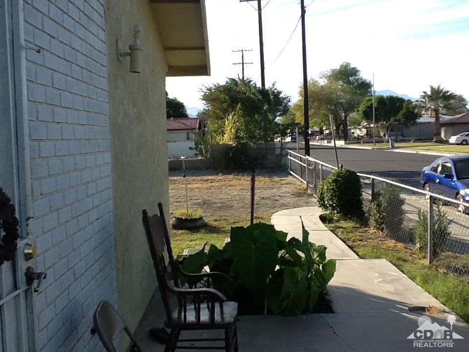 46751 Arabia Street Indio, CA 92201 - Photo 9 of 42 a view of a chairs and table in the balcony