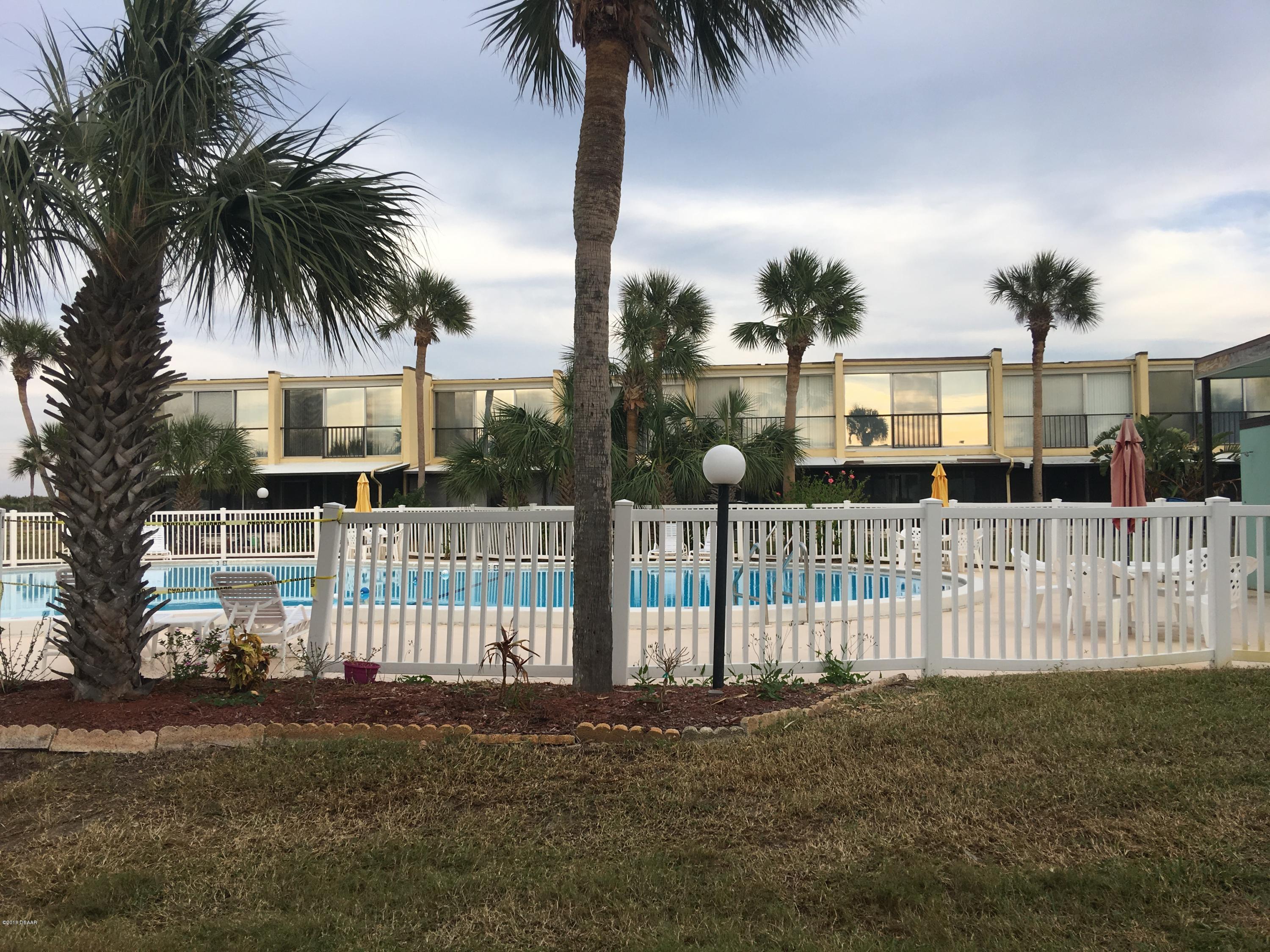 5500 Ocean Shore Boulevard, Unit 52 Ormond Beach, FL 32176 - Photo 15 of 33 a front view of house with wooden fence