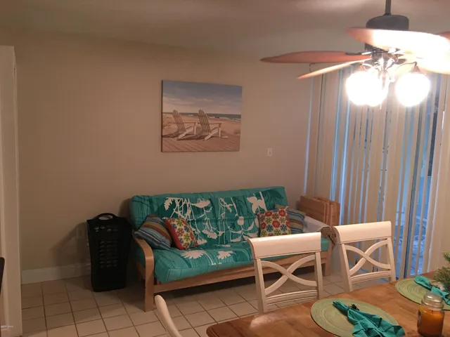 a balcony with chairs and a table