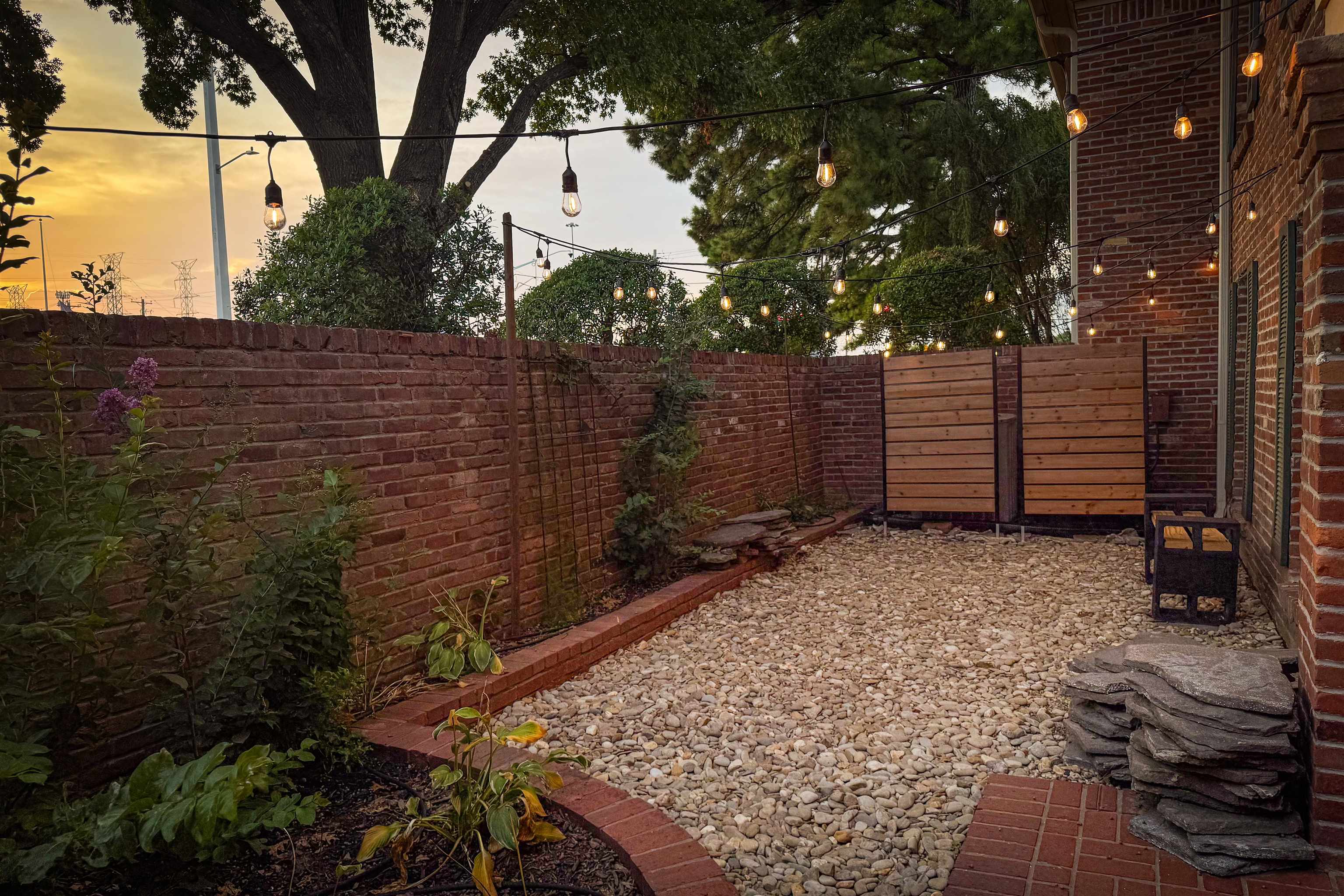 1184 Lynnfield Road, Unit 1 Memphis, TN 38119 - Photo 1 of 28 Enjoy the warm ambient glow of sunset on your private patio.
