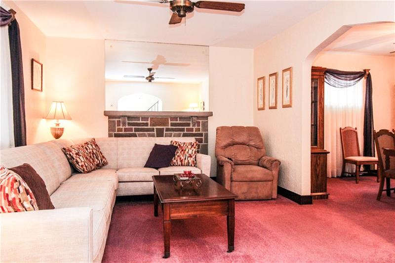 101 Greenlee Road Pittsburgh, PA 15227 - Photo 4 of 22 Living room with plenty of natural light opens up nicely to the dining room.