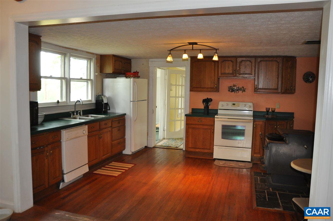 121 Turkey Mountain Road Amherst, VA 24521 - Photo 13 of 40 a kitchen with stainless steel appliances granite countertop a stove a sink and a refrigerator