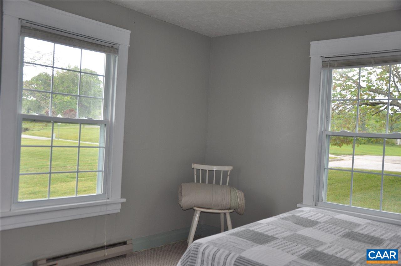 121 Turkey Mountain Road Amherst, VA 24521 - Photo 26 of 40 a bedroom with a bed and a window