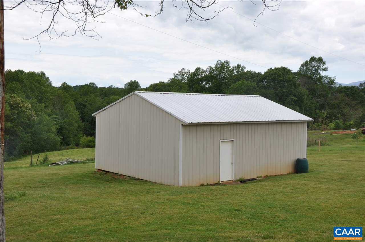 121 Turkey Mountain Road Amherst, VA 24521 - Photo 10 of 40 a backyard of a house with lots of green space and mountain view in back